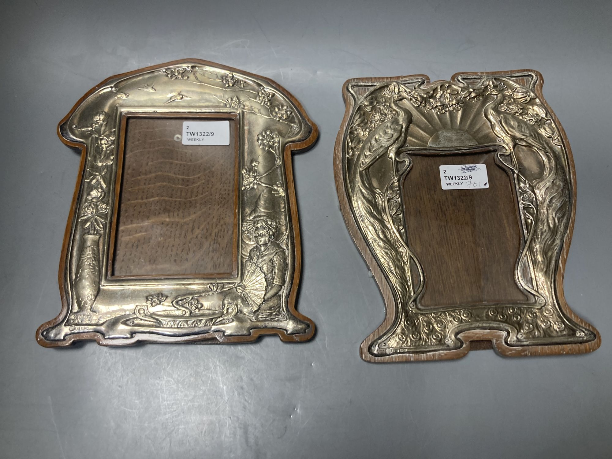 Two Art Nouveau silver-mounted wooden easel photograph frames by Hukin & Heath,